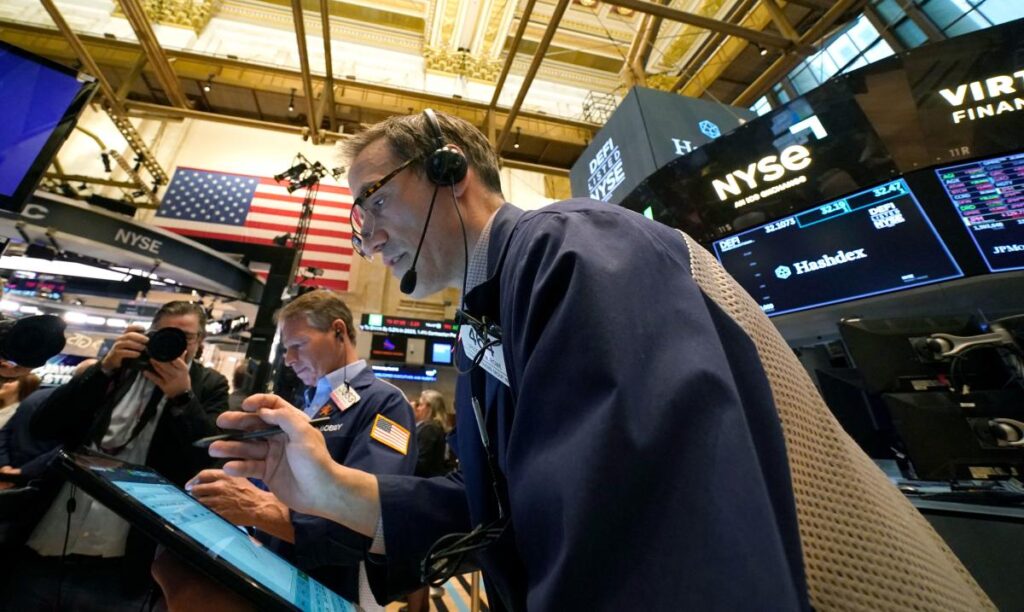 Stocks teeter after Federal Reserve raises rates by 0.25%