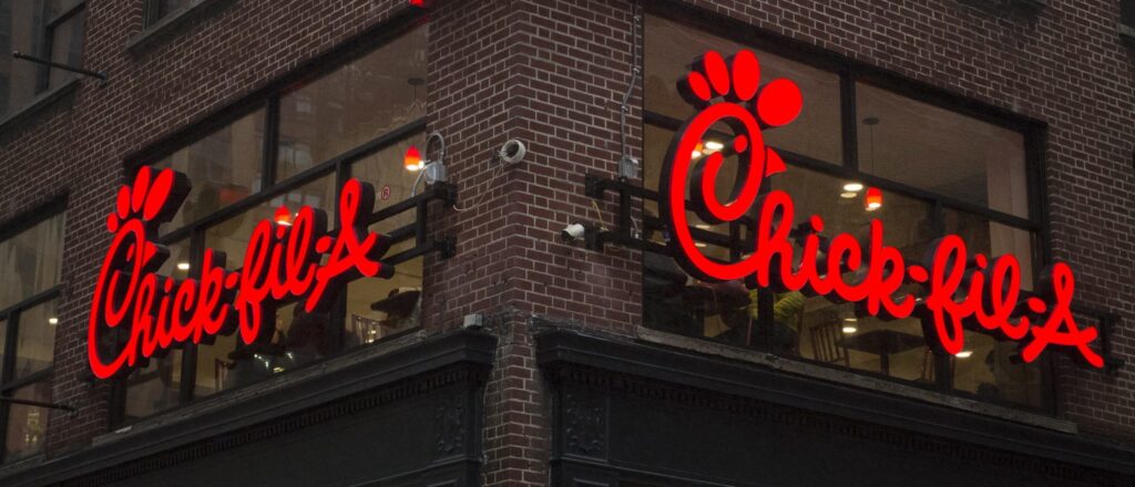 A franchise sign is seen above a Chick-fil-A freestanding restaurant after its grand opening in Midtown, New York