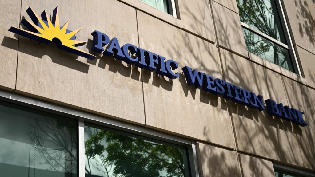 Stocks moving big midday: PACW, DKNG, PFE, FL