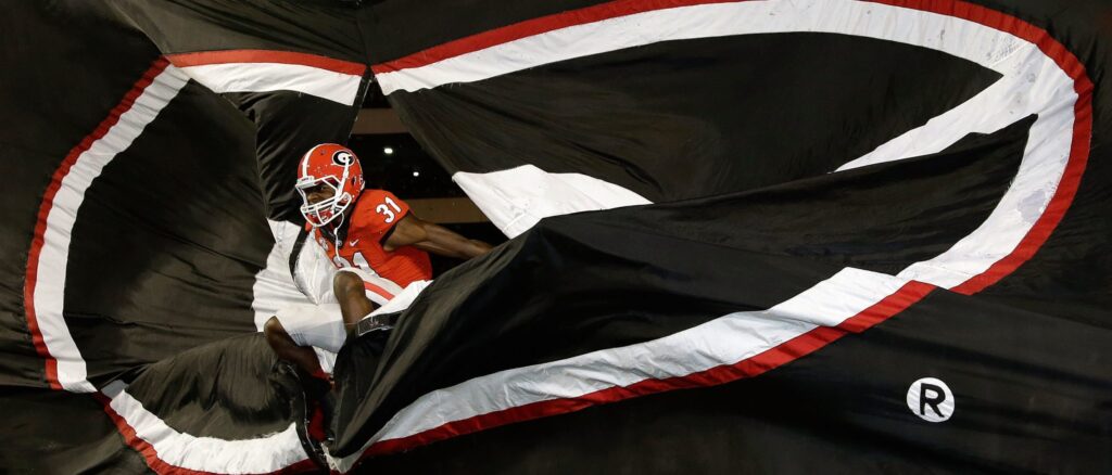 Wide receiver Chris Conley #31 of the Georgia Bulldogs jumps through the G sign before pre-game introductions before the game against the Kentucky Wildcats at Sanford Stadium on November 23, 2013 in Athens, Georgia. (Photo by Mike Zarrilli/Getty Images)