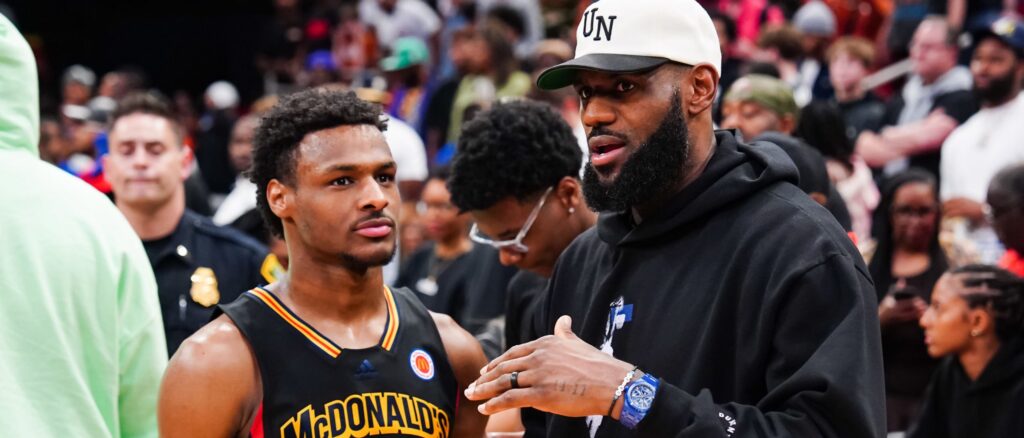 Bronny James #6 of the West team talks to Lebron James of the Los Angeles Lakers after the 2023 McDonald