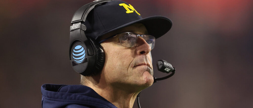 Head coach Jim Harbaugh of the Michigan Wolverines looks on during the Vrbo Fiesta Bowl at State Farm Stadium on December 31, 2022 in Glendale, Arizona. The Horned Frogs defeated the Wolverines 51-45. (Photo by Christian Petersen/Getty Images)