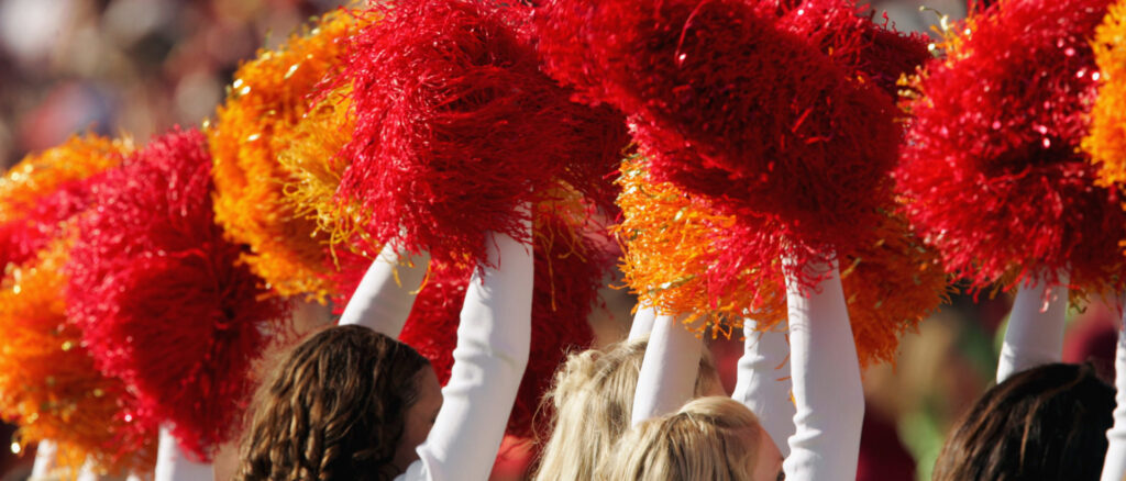 Members of the USC Song Girls squad perform with cardinal and gold pompoms during the game against the Washington State Cougars on October 29, 2005 at the Los Angeles Memorial Coliseum in Los Angeles, California. USC won 55-13. (Photo by Stephen Dunn/Getty Images)