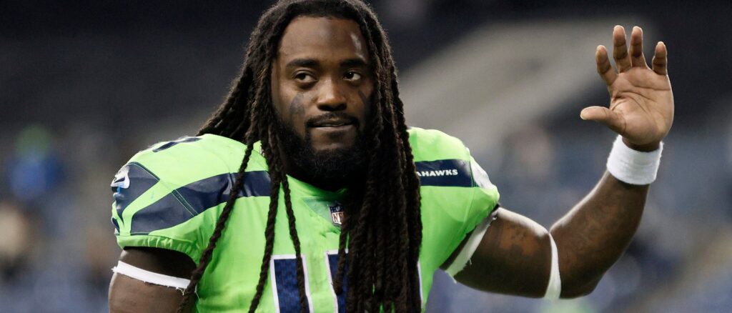 Alex Collins #41 of the Seattle Seahawks jogs off the field after losing 26-17 to the Los Angeles Rams at Lumen Field on October 07, 2021 in Seattle, Washington. (Photo by Steph Chambers/Getty Images)