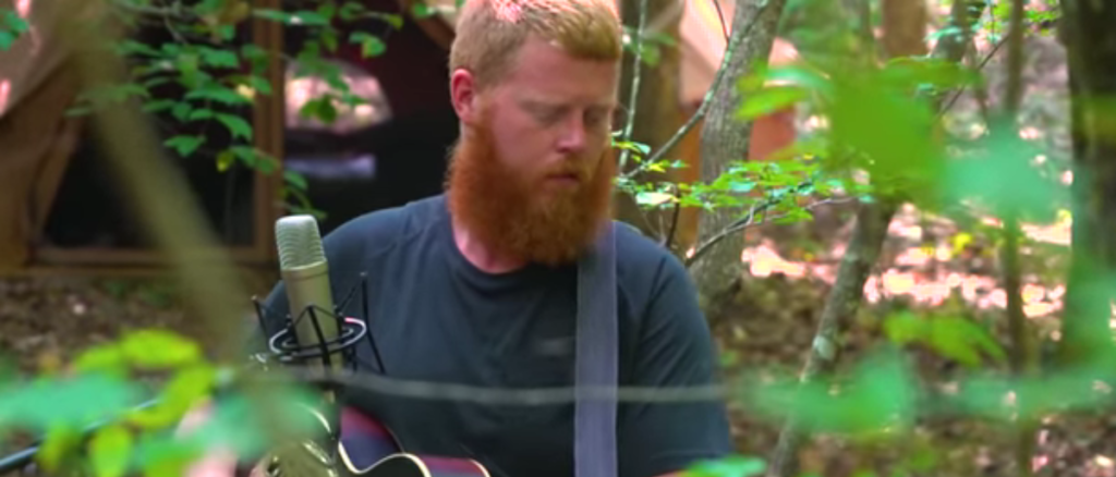 Country singer Oliver Anthony released a new music video for his latest song "90 Some Chevy" in which a handgun is briefly seen near the passenger seat.