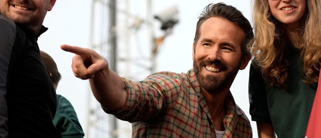 WREXHAM, WALES - MAY 02: Ryan Reynolds, Co-Owner of Wrexham Football Club celebrates with players of Wrexham Men