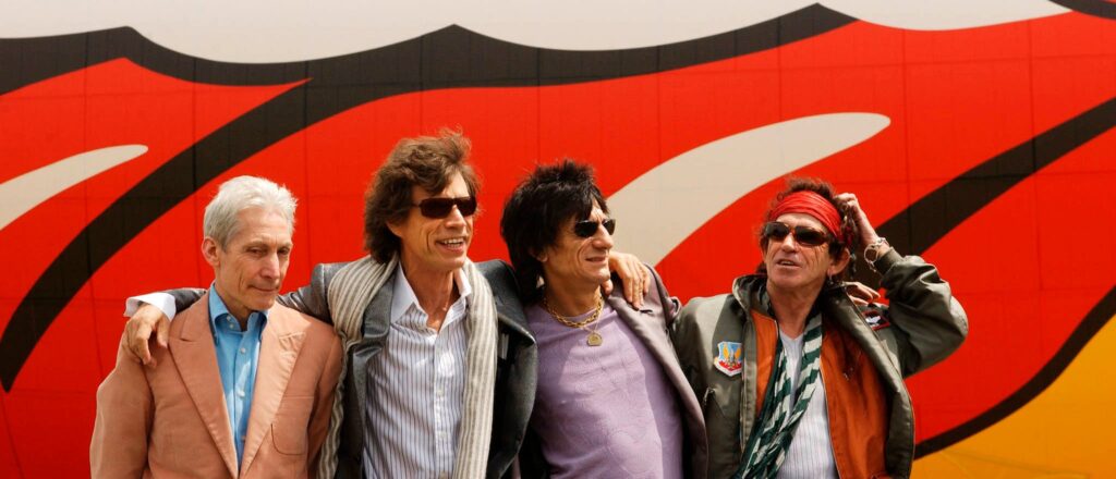Charlie Watts (L), Mick Jagger (2L), Ron Wood (2R)