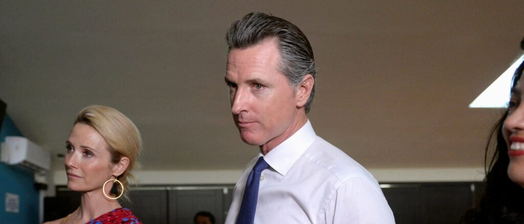 Governor of U.S. state of California Gavin Newsom and his wife Jennifer Siebel Newsom visit the premises of a migrant assistance office in San Salvador