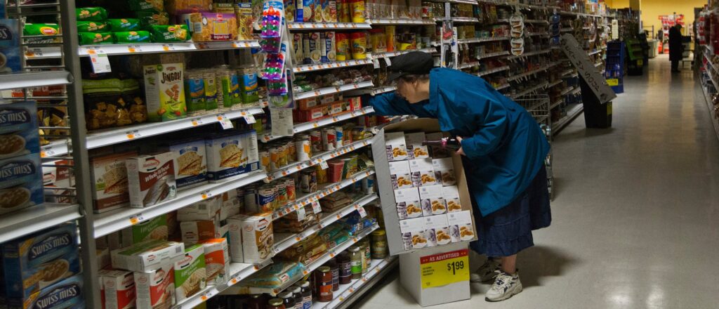 A woman looks for supplies at a Waldbaums grocery store in Long Beach, New York