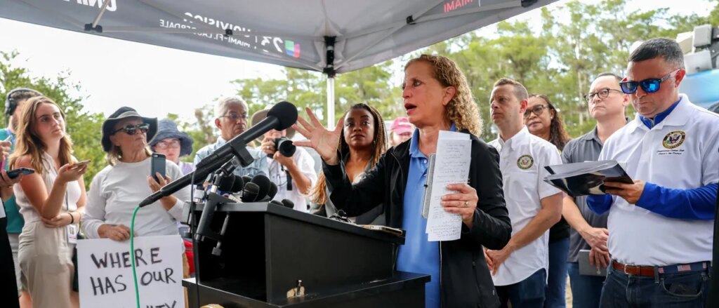Debbie Wasserman Schultz Announces Run For Mainly Black District With Obama Poster In Background Debbie Wasserman Schultz Announces Run For Mainly Black District With Obama Poster In Background