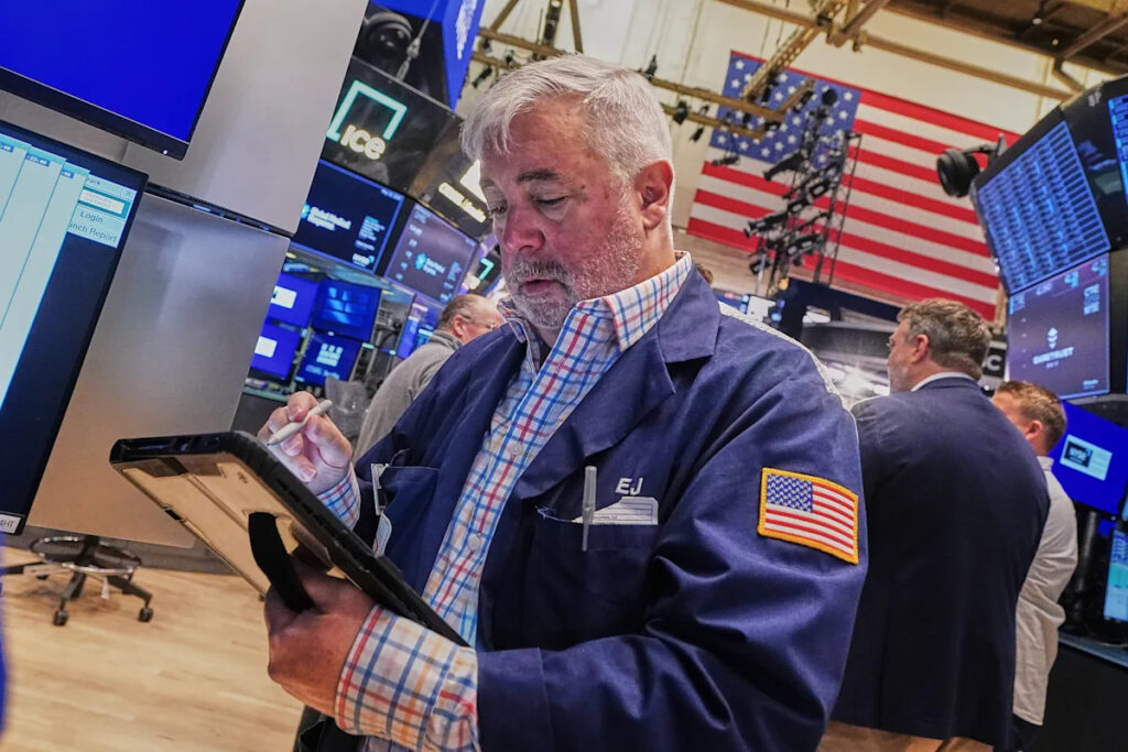 Tech carries Wall Street to records, even as most stocks fall after discouraging inflation data