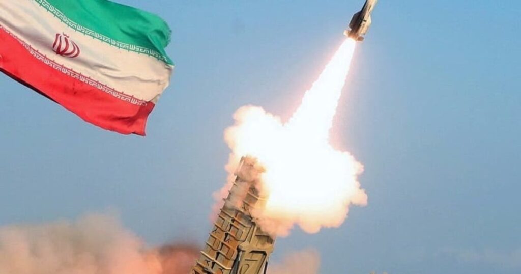 State Department Issues Worldwide Travel Advisory Amid Escalations in Iran War, Says US Interests May Be Targeted * The Gateway Pundit * by Jordan Conradson Iranian missile launch with the national flag in the foreground, showcasing military capabilities and defense technology during a test or demonstration.