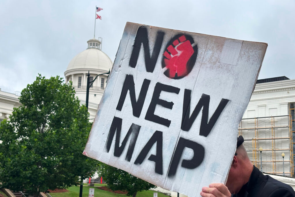 ‘We're fighting this by ourselves’: Southern Black leaders feel abandoned by Democratic Party A demonstrator holds up a sign outside the Alabama Statehouse in Montgomery, Alabama, on May 7, 2026.