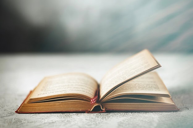 105 Quotes About Reading That Will Inspire You and Make You Think An open, older book.
