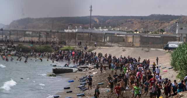 Spain Migrant Crisis as Thousands Swim Across Border From Morocco