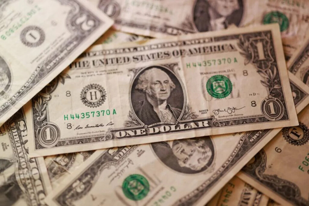 Dollar higher after Iran sanctions, loonie drops after US announces tariff increases