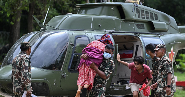 Nepal Rescue Workers Use Ziplines to Reach Flood Victims