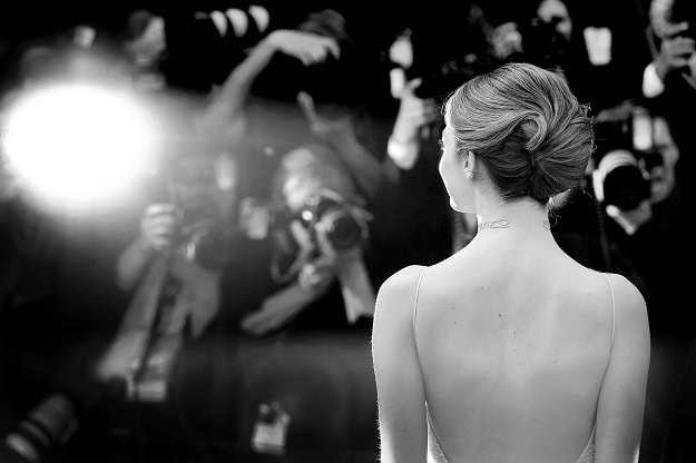 120 Funny Quotes From Famous People: Hilarious Humor by Celebrities Emma Stone at a movie premiere.